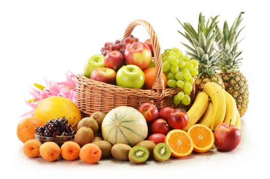 Composition with assorted fruits in wicker basket isolated on white
