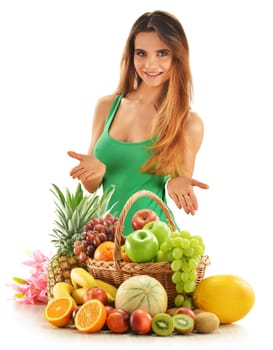 Young woman with assorted fruits in wicker basket isolated on white