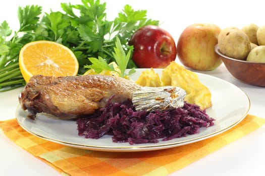 Leg of duck with red cabbage and duchess potatoes