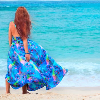 Rear view of woman near the sea