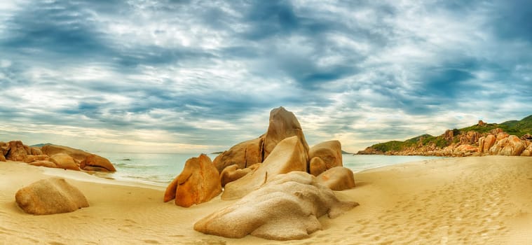 Beautiful beach panorama. Stones on the foreground