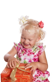 little girl opening gift box, isolated on white