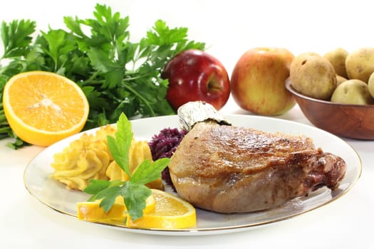 Leg of duck with red cabbage and duchess potatoes