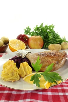 Leg of duck with red cabbage and duchess potatoes