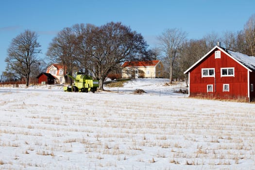 old red farm, cottage, in snowy winter time, scenry from sweden