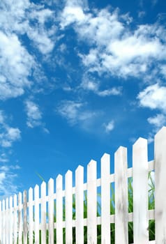 white fence with blue sky