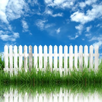 white fence with blue sky