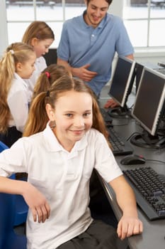 Girl in school class smiling to camera
