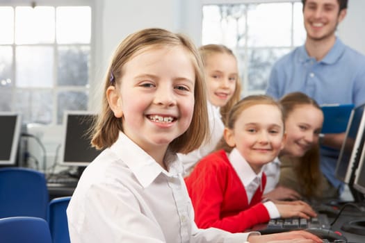 Girls and teacher in school class