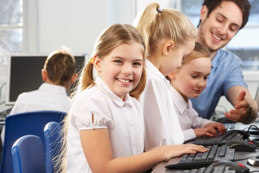 Girl in school class smiling to camera