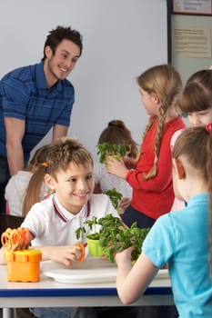 Children learning about plants in school class