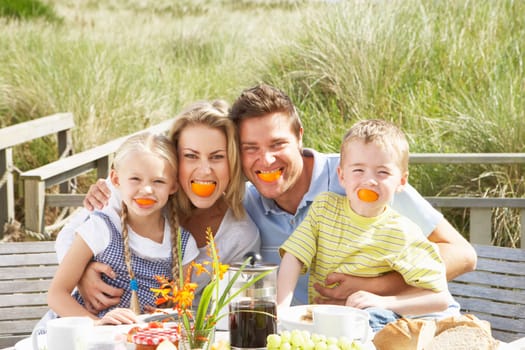 Family on vacation eating outdoors