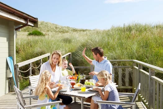 Family on vacation eating outdoors