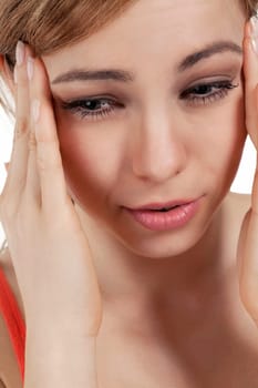 Young pretty blonde woman suffering from headache