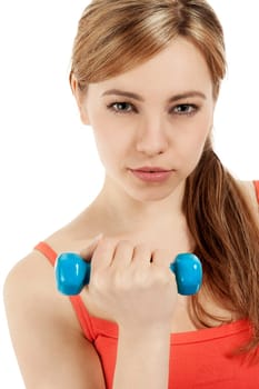 Pretty blonde sportswoman exercising with a fitness dumbbell against white background