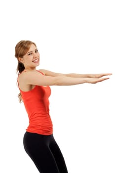 Young sportswoman doing fitness exercises in front of white background