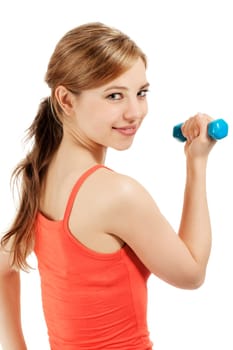 Pretty sportswoman with fitness dumbbell looking over shoulder against white background