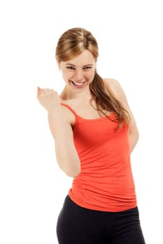 Successful sportswoman making a fist in front of white background