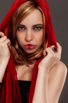 Fantasy portrait of a young woman with red cloth