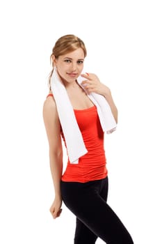 Pretty young sportswoman with towel against white background