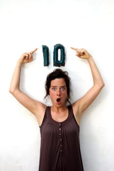 young woman pointing at a ten