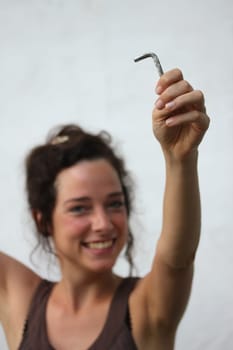 young woman holding an allen key