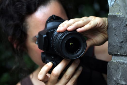 young woman with a dslr camera