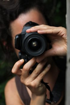 young woman with a dslr camera