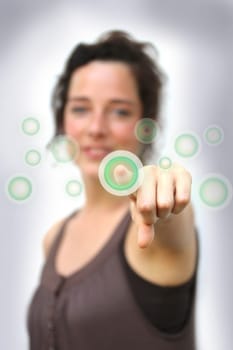 young woman pointing at a digital interface