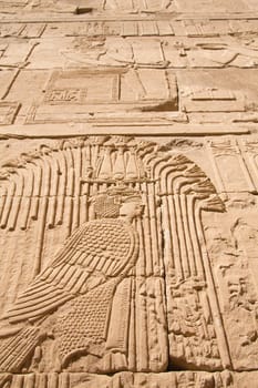Carving of Egyptian god on pylon in Temple of Kalabsha, near Aswan (Nubia, Egypt)