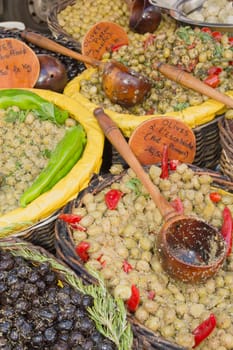 Assortment of olives, pickles and salads on market stand.(Provence, France)
