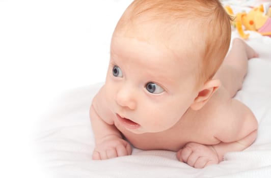 Cute Naked Red Haired Baby Lying on Front