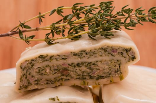 Close-up of a dumpling with thyme
