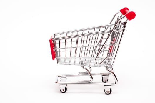 Shopping cart from the side against white background