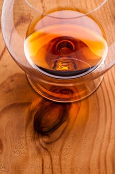 Brandy de Jerez in a glass on a wooden board