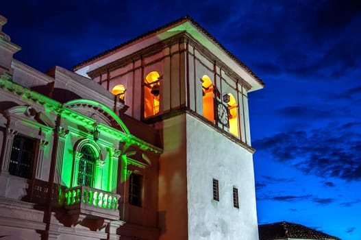 The clock tower in Popayan, Colombia during the blue hour.