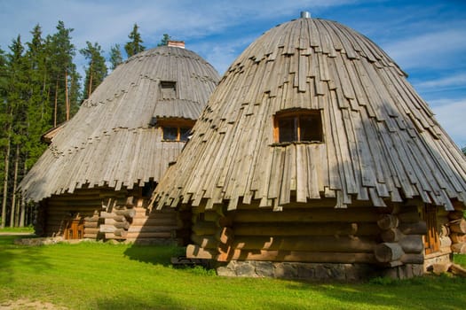 Two interesting architecture houses maded from round wood