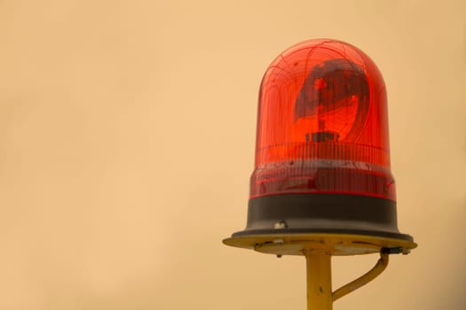 Red beacon on yellow metallic rod warning seekers