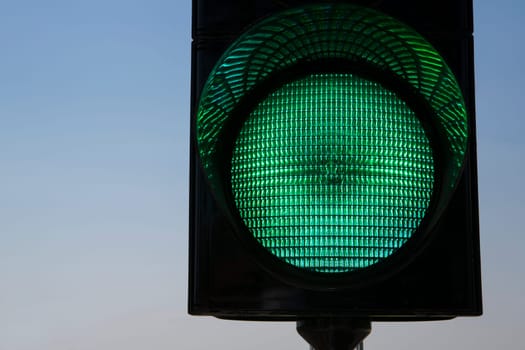 Shaded trafficlight which warning car drivers to stop