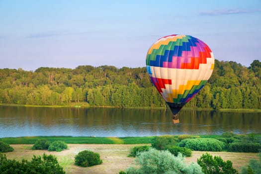 Painted in colours balloon fly high in sky