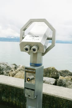 Silver coin operated pay binoculars
