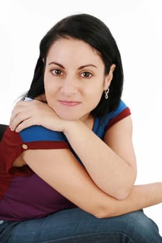 Portrait of a beautiful young woman looking at the camera and smiling, isolated on a white background
