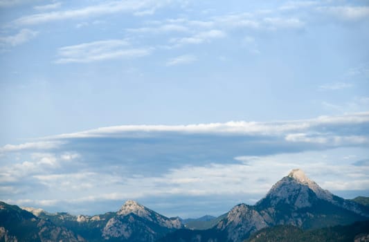 View of a mountain range in the Oberallgäu at dusk with light,clouds