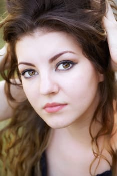 Portrait of a beautiful 20 year old woman enjoying a summer day outdoor.