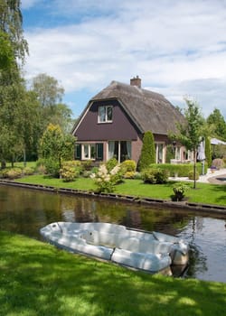 the idyllic Village of Giethoorn, also knows as Venice of the Netherlands, with its typical houses, bridges and canals