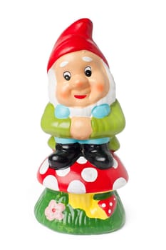 Garden gnome on a mushroom isolated on white