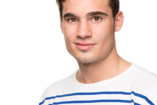 Portrait of a young man against a white studio background