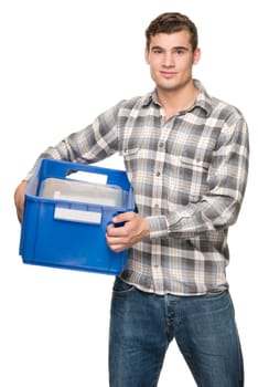 Young man with a blue box against a white studio background