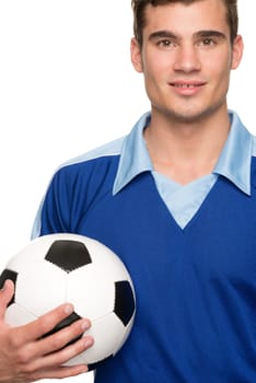 Young man with a soccer ball in front of white studio background