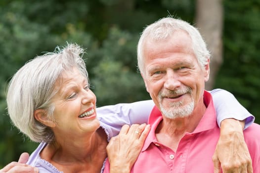 Happy senior couple in a park